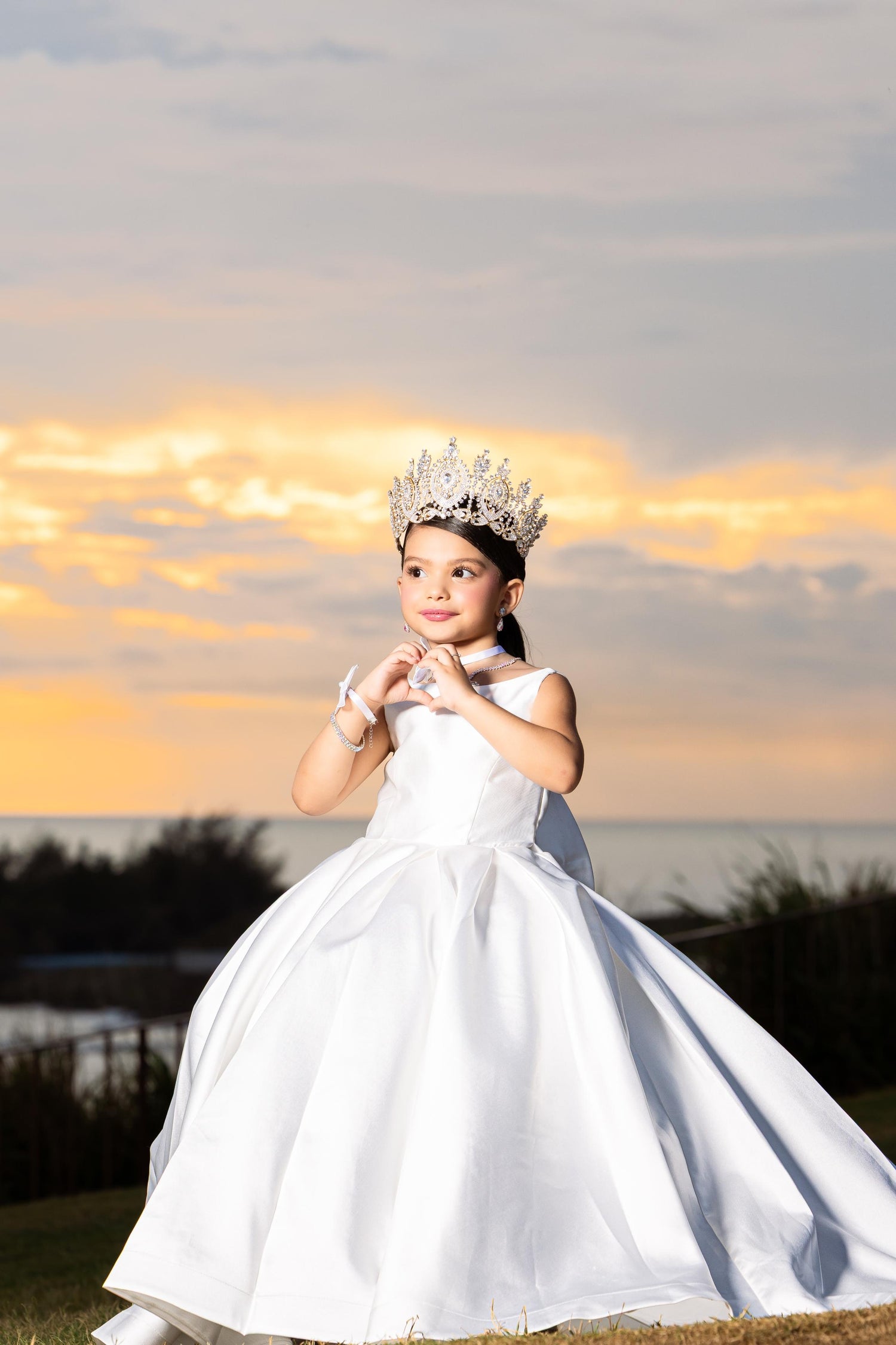 Girl wearing white satin flower girl dress outdoors
Size chart for girls satin ball gown sizes 2 to 14 Baby Girl Dress