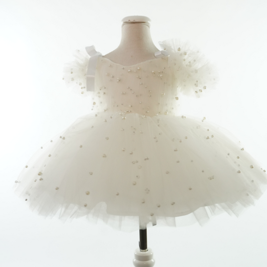 a dress on a mannequin on a white background