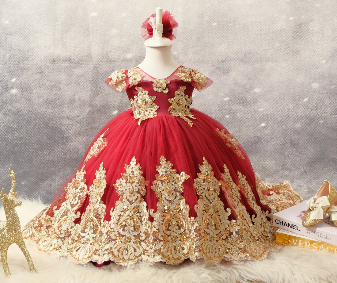Luxurious Charlotte burgundy gown for girls, featuring a blend of cotton, tulle, satin, and lace for a refined and elegant children's couture look. Charlotte Burgundy Gold Lace Girl’s Gown with Elegant Tail Baby Girl Dress for Special Occasion