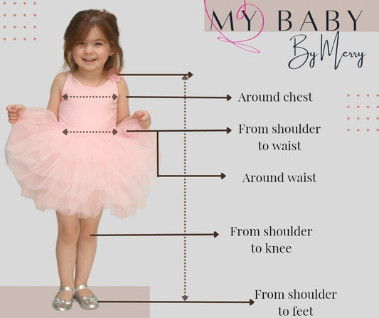 a little girl in a pink dress with her measurements
