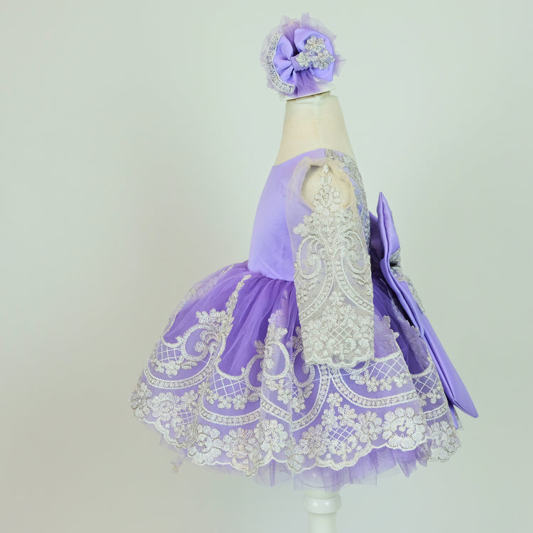 a purple and white dress on a mannequin