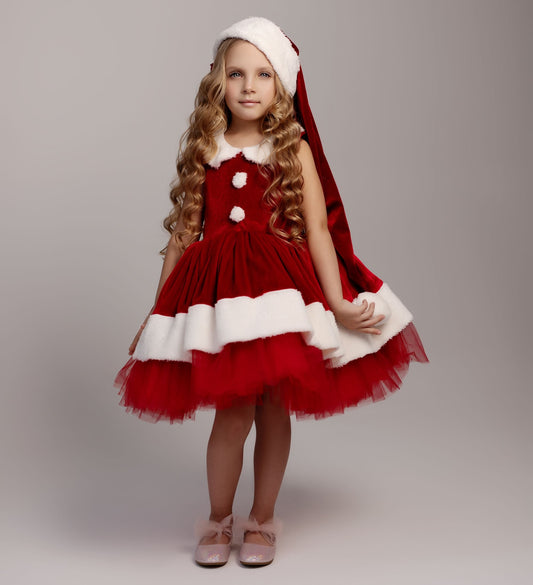 a little girl dressed up as santa clause