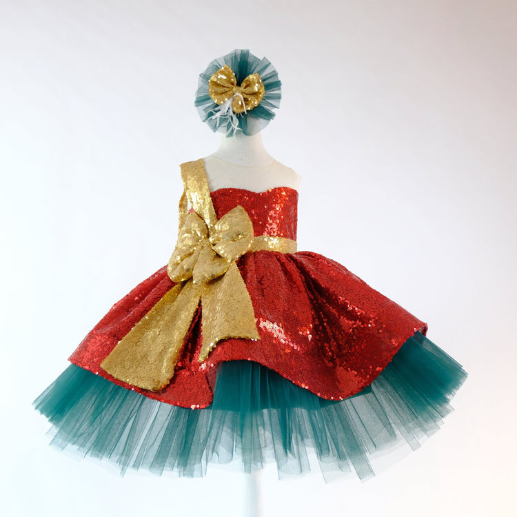 a red and blue dress with a gold bow