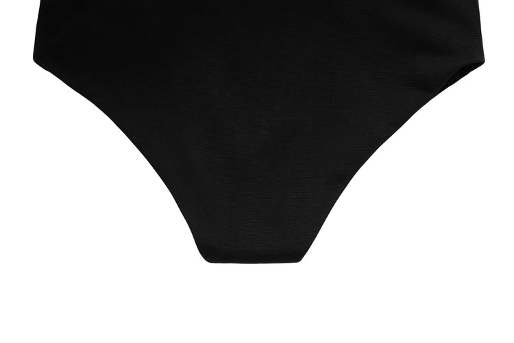 a woman in a black bikini bottom