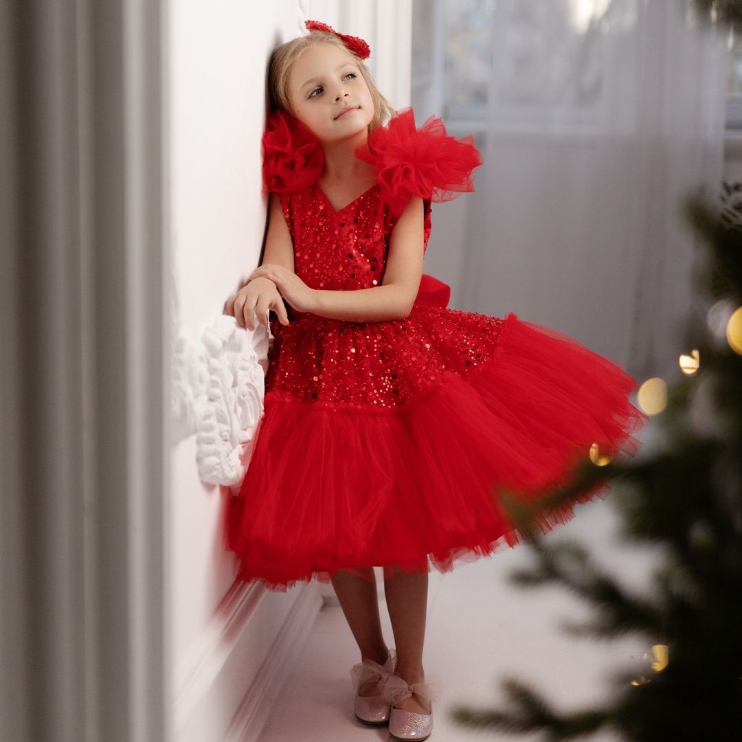 a little girl in a red dress standing next to a christmas tree Baby Girl Dress for Special Occasion
