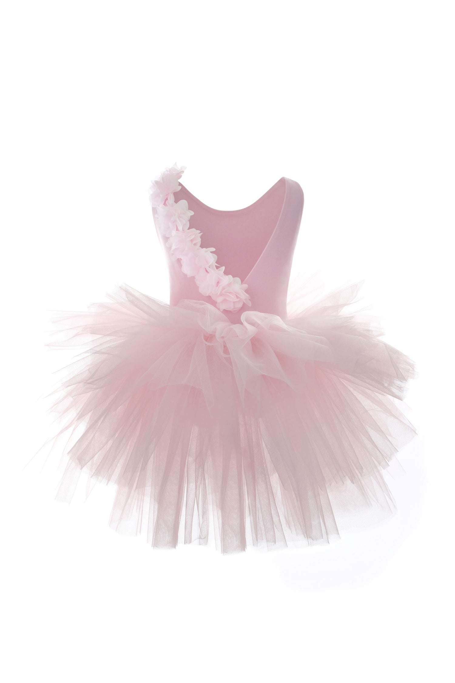 a little girl's pink dress on a white background