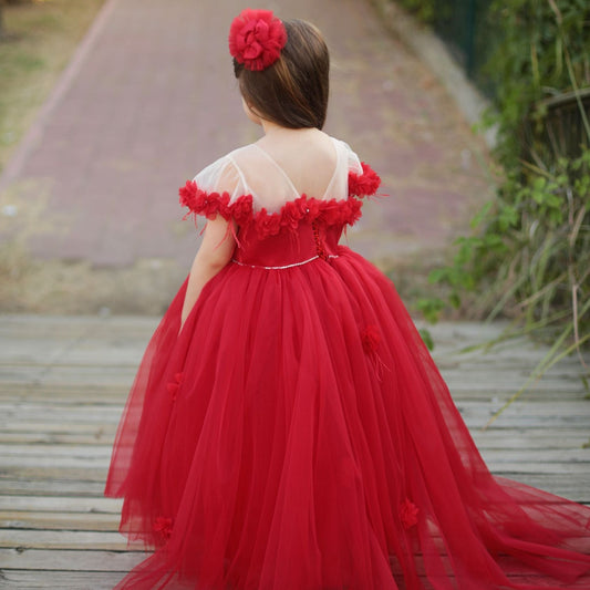 a little girl in a red dress 