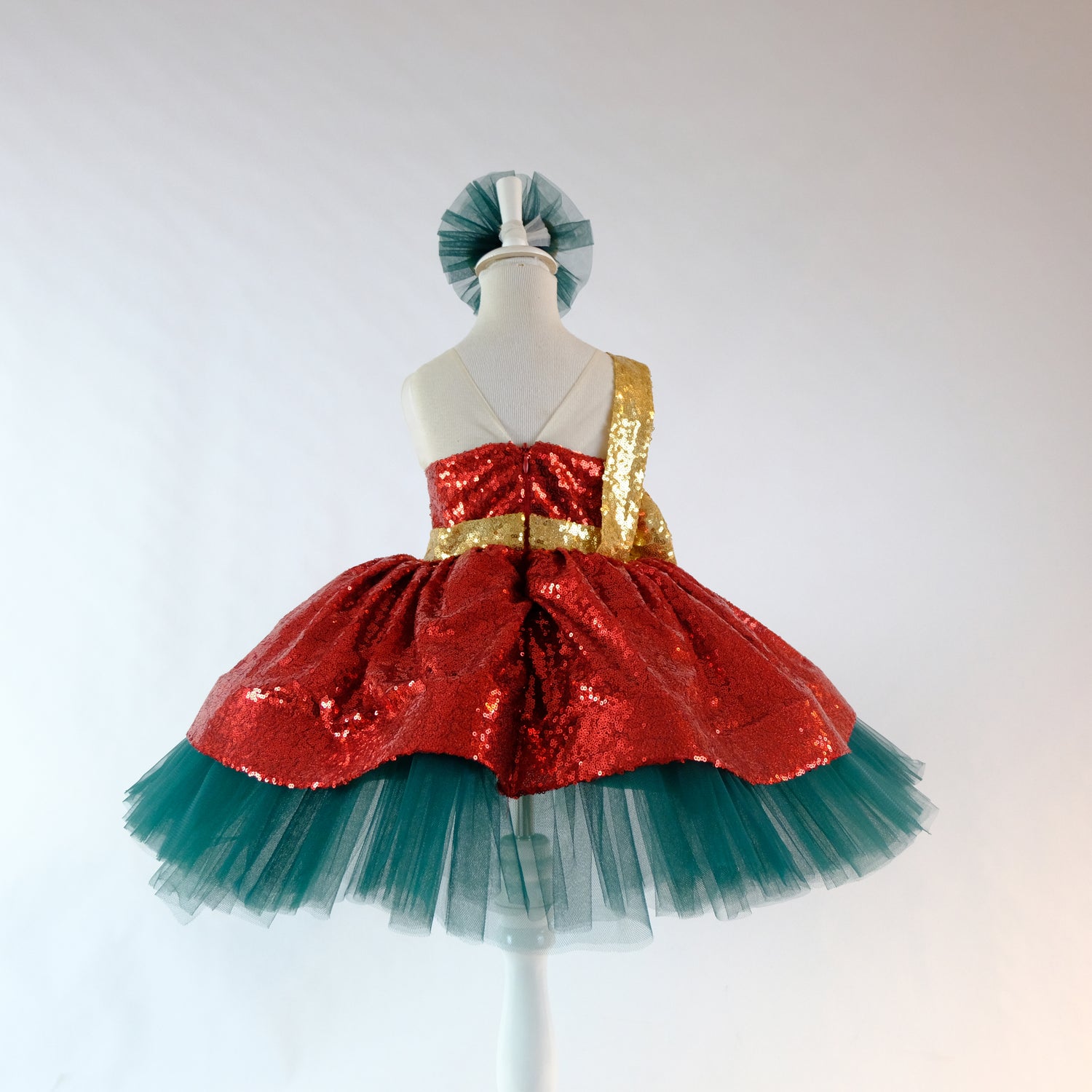 a red and green dress on a mannequin