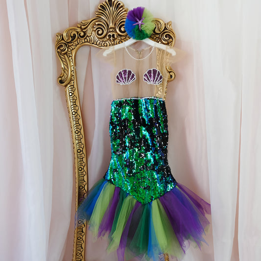 a little girl's green and purple mermaid costume