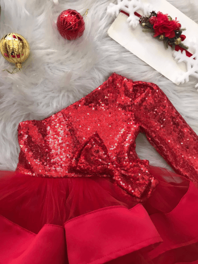  Close-up of the sequin details on the red puffy Christmas dress for baby girls.
